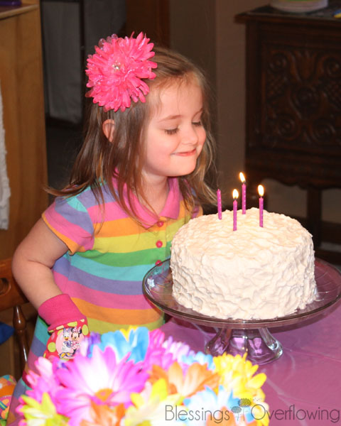 Blowing out the Candles on the Rainbow Cake